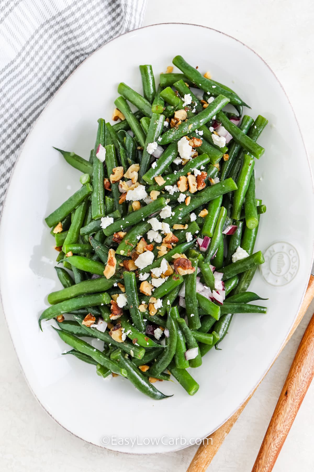 A serving dish with green bean salad