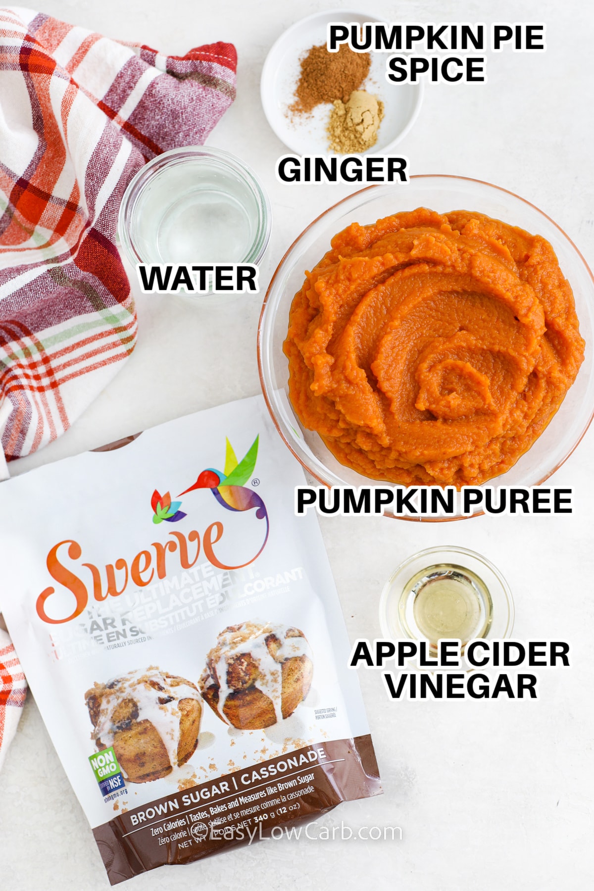 ingredients for pumpkin butter including pumpkin pie spice, ginger, pumpkin puree, apple cider vinegar, and swerve