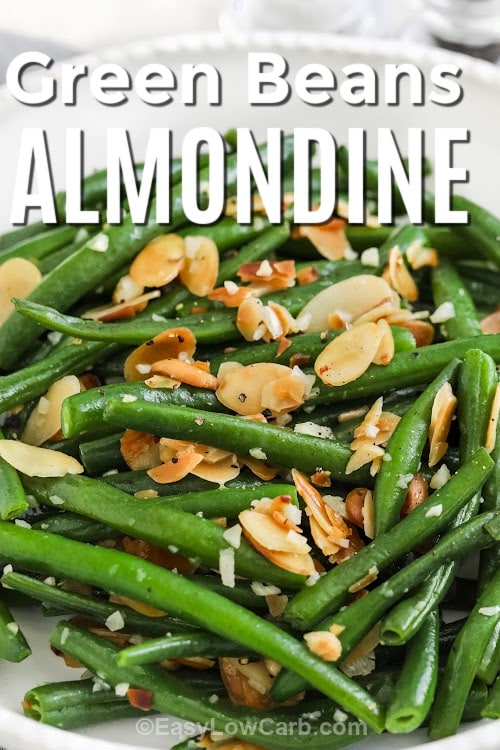 A serving dish of green beans almondine with a title