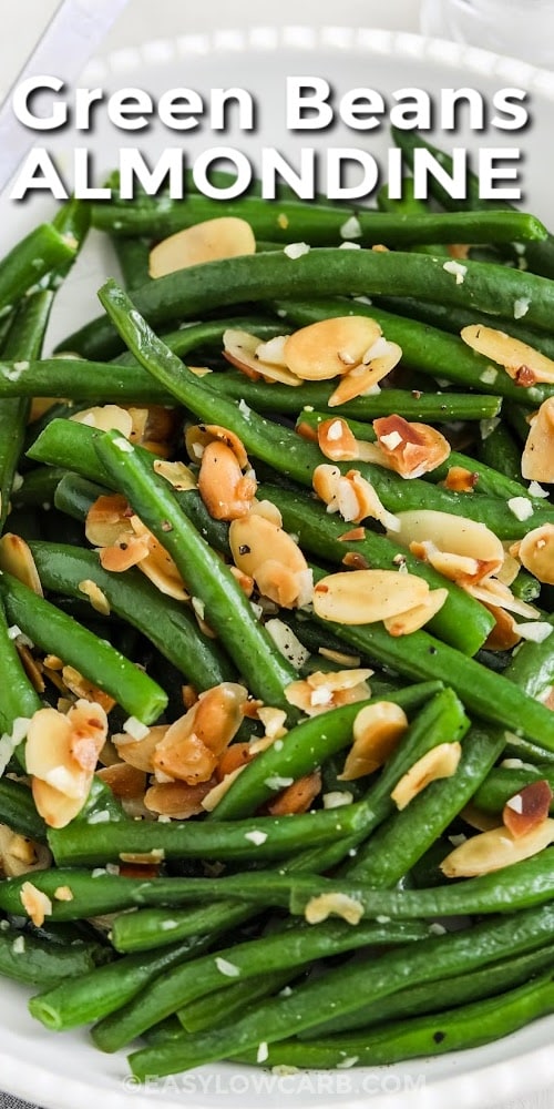 A serving bowl of green beans almondine with text