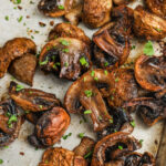 Oven Roasted Mushrooms on a tray with a title