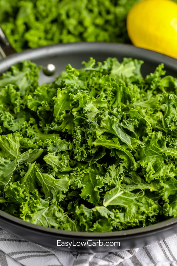 raw kale in a pan for Sauteed Kale