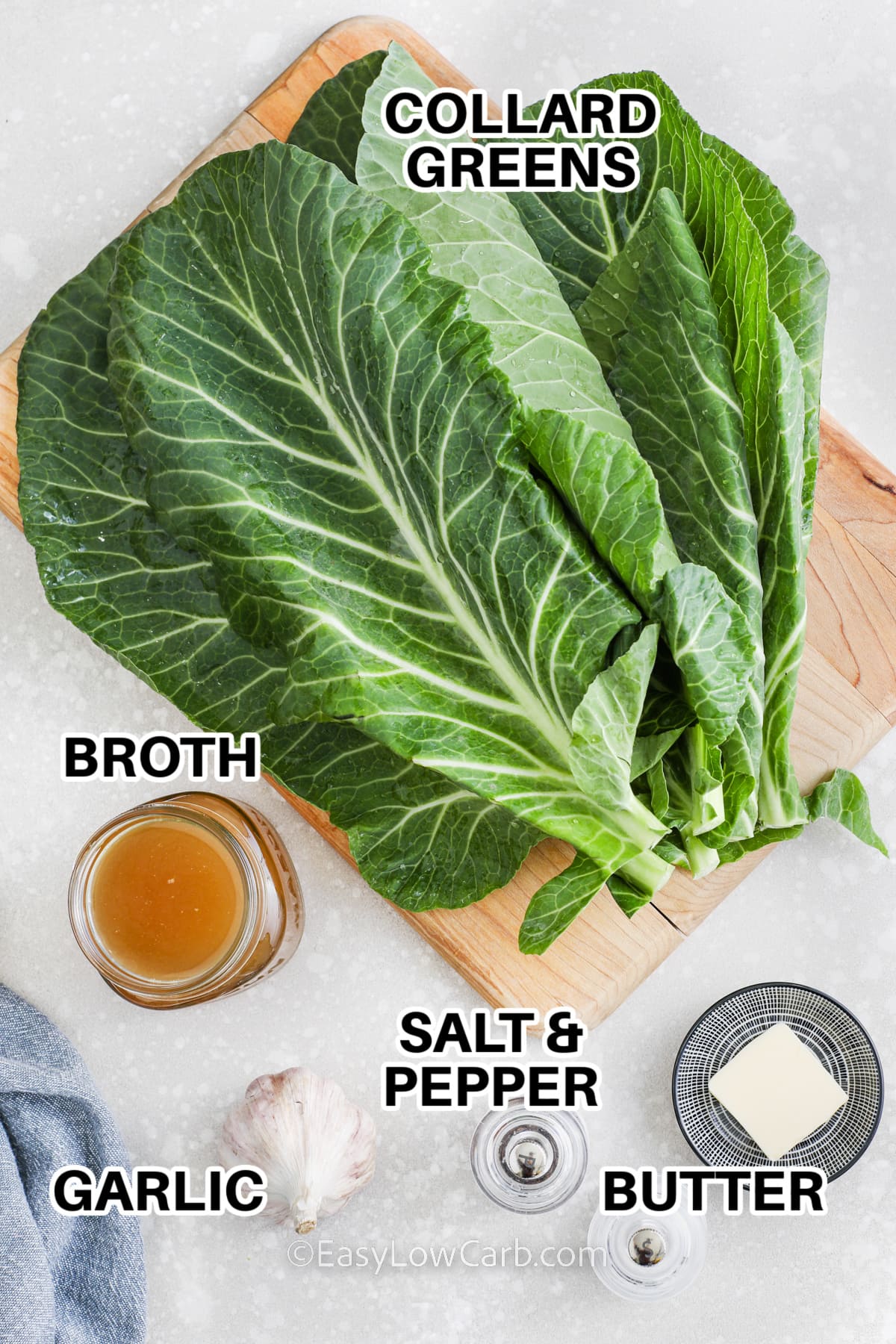 ingredients to make sauteed collard greens including collard greens, broth, salt, pepper, garlic, and butter