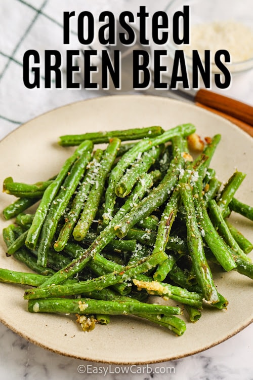 oven roasted green beans on a plate with writing