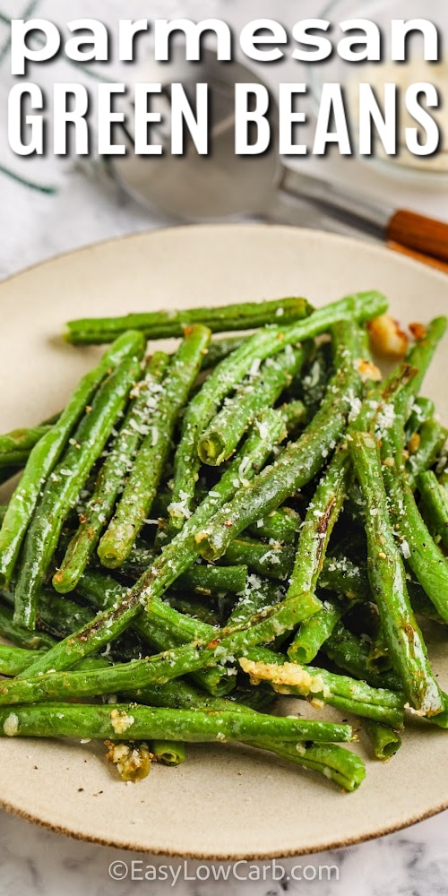 oven roasted green beans on a plate with a title