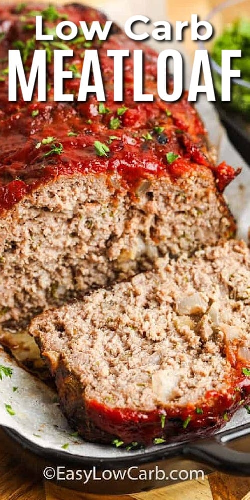 cooked low carb meatloaf, on a parchment lined baking sheet, with a title.