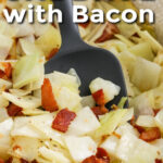 close up of Fried Cabbage with Bacon in the dish with writing