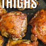 taking a piece of Skillet Chicken Thighs out of the pan with a title
