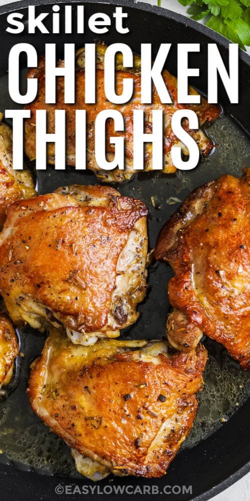taking a piece of Skillet Chicken Thighs out of the pan with a title
