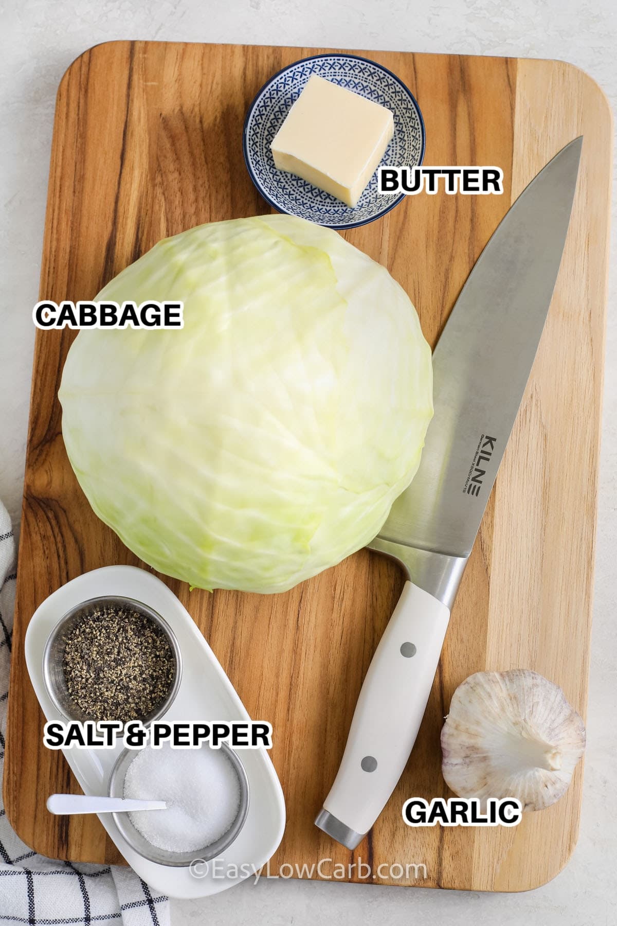 ingredients to make cabbage steak labelled: butter, cabbage, salt, pepper, and garlic