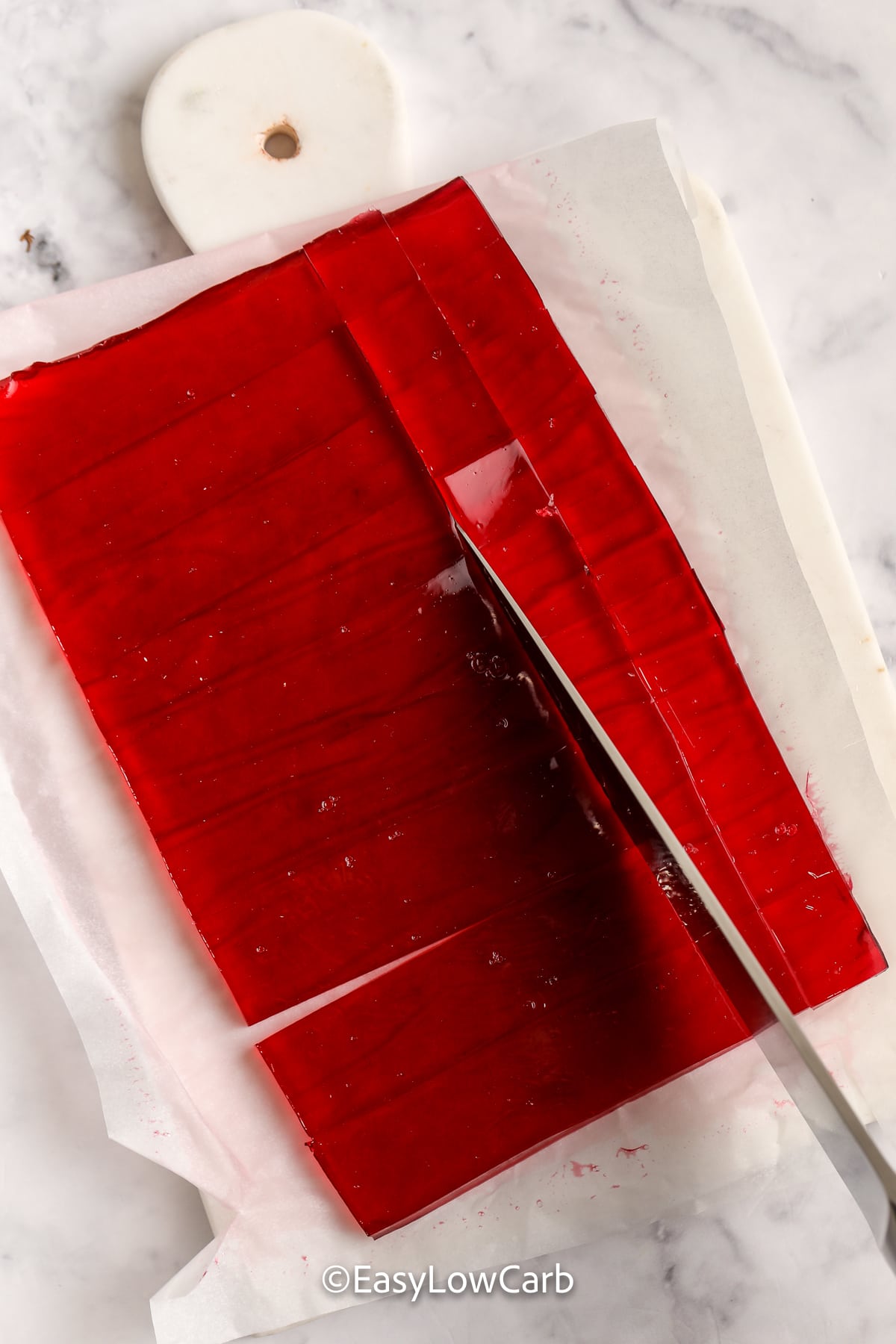 Keto Gummies being cut into a square