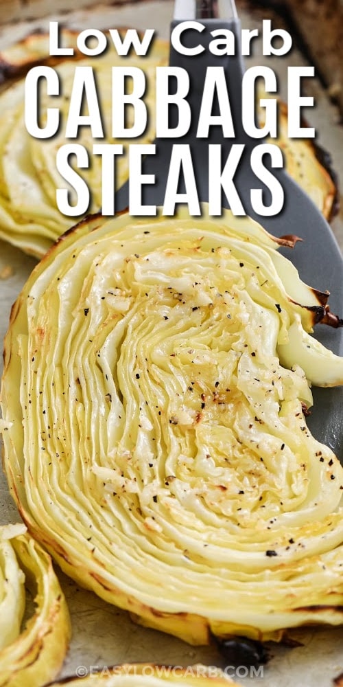 A roasted cabbage steak being lifted off a baking tray with a title