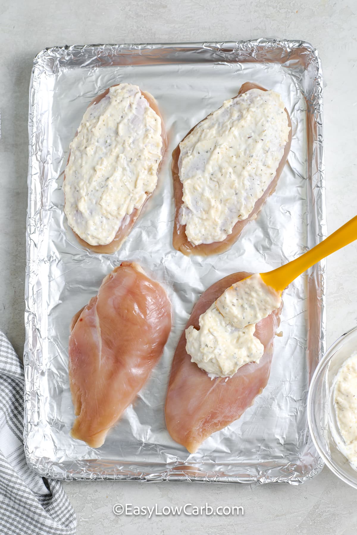 Chicken breasts topped with a mayonnaise parmesan mixture