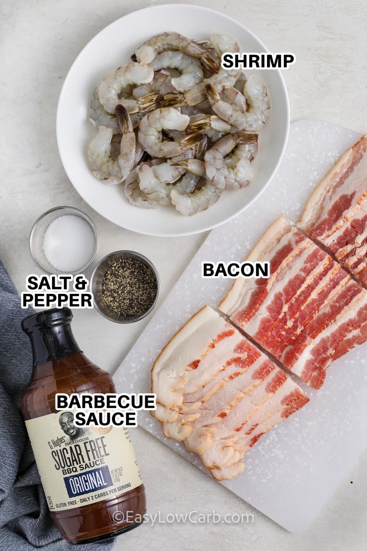 Ingredients to make Bacon Wrapped Shrimp labeled: Shrimp, Salt & Pepper, Bacon, and Barbecue Sauce