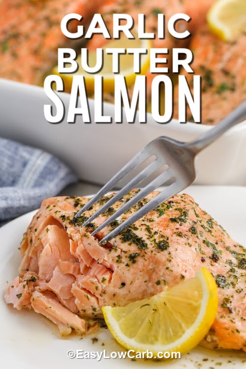 A garlic butter salmon fillet being eaten with a fork with text