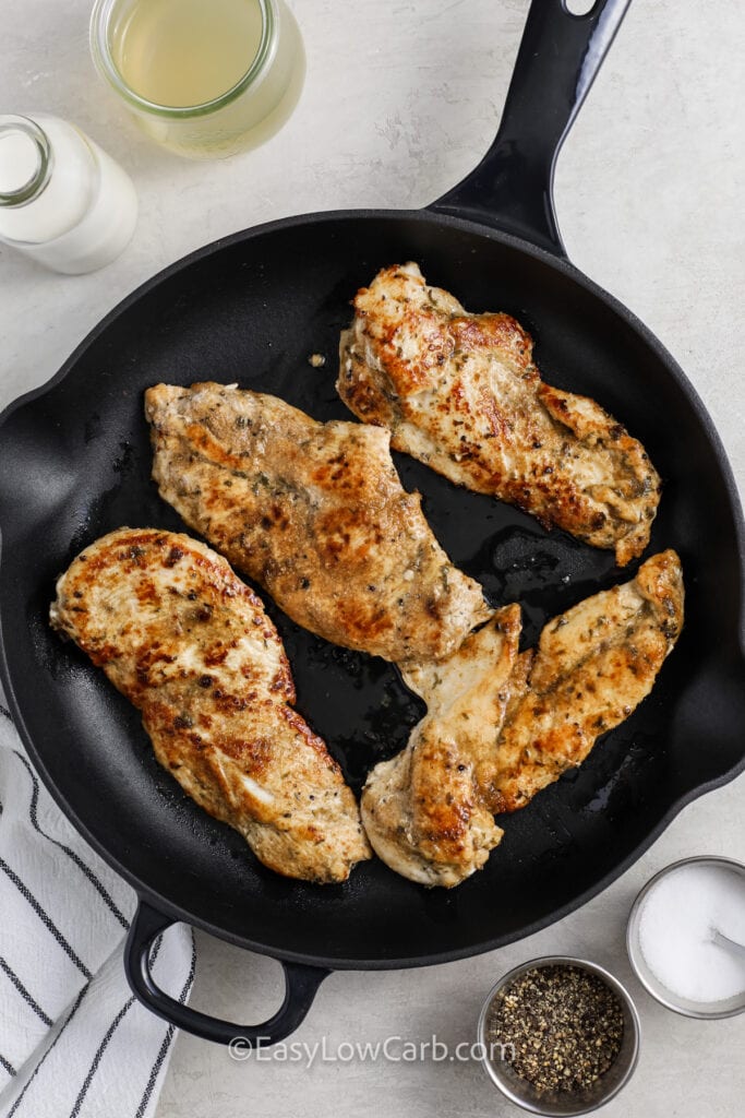 cooked seasoned chicken in a skillet