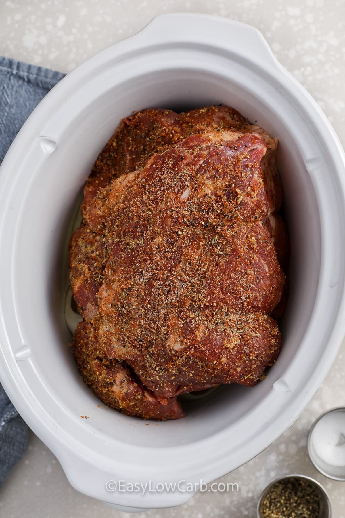 seasoned pork shoulder in a crock pot