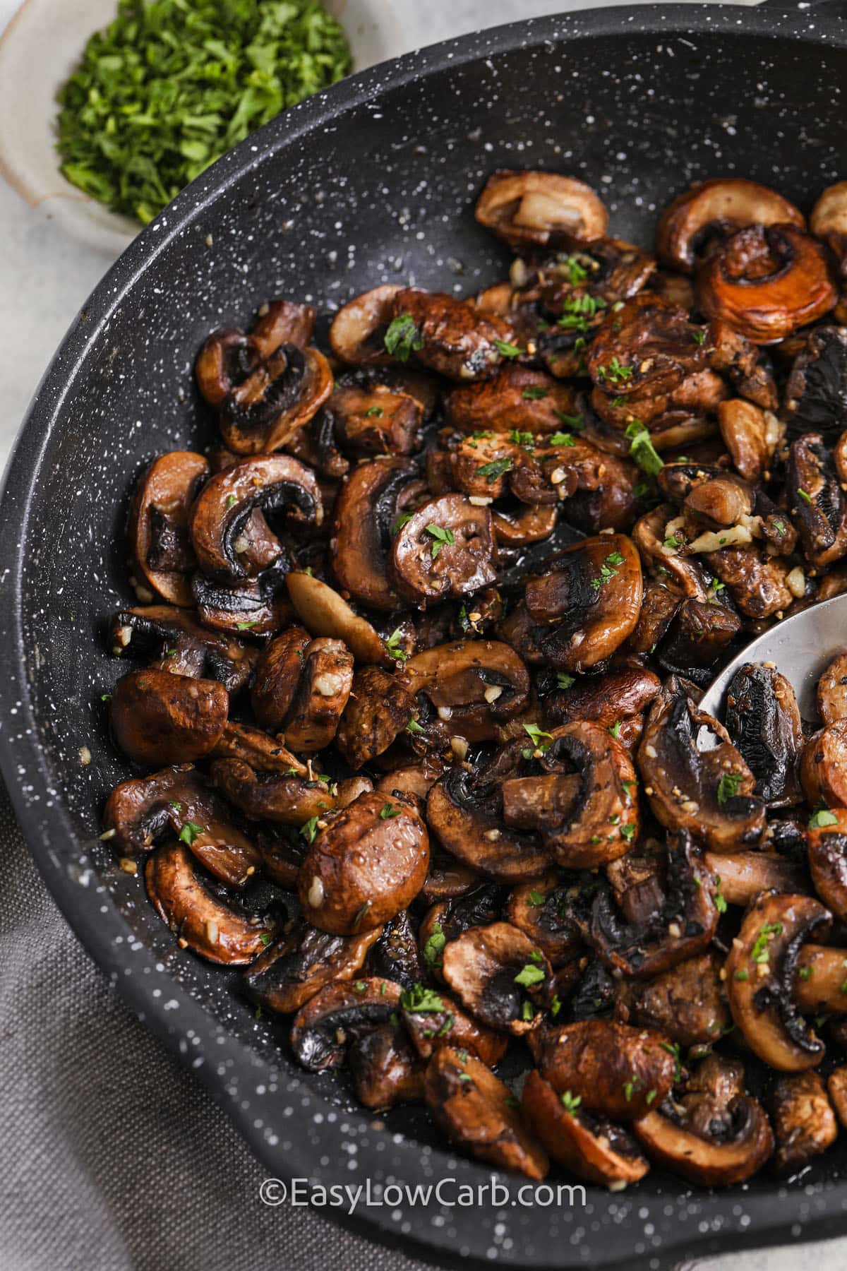 pan full of cooked Garlic Butter Mushrooms