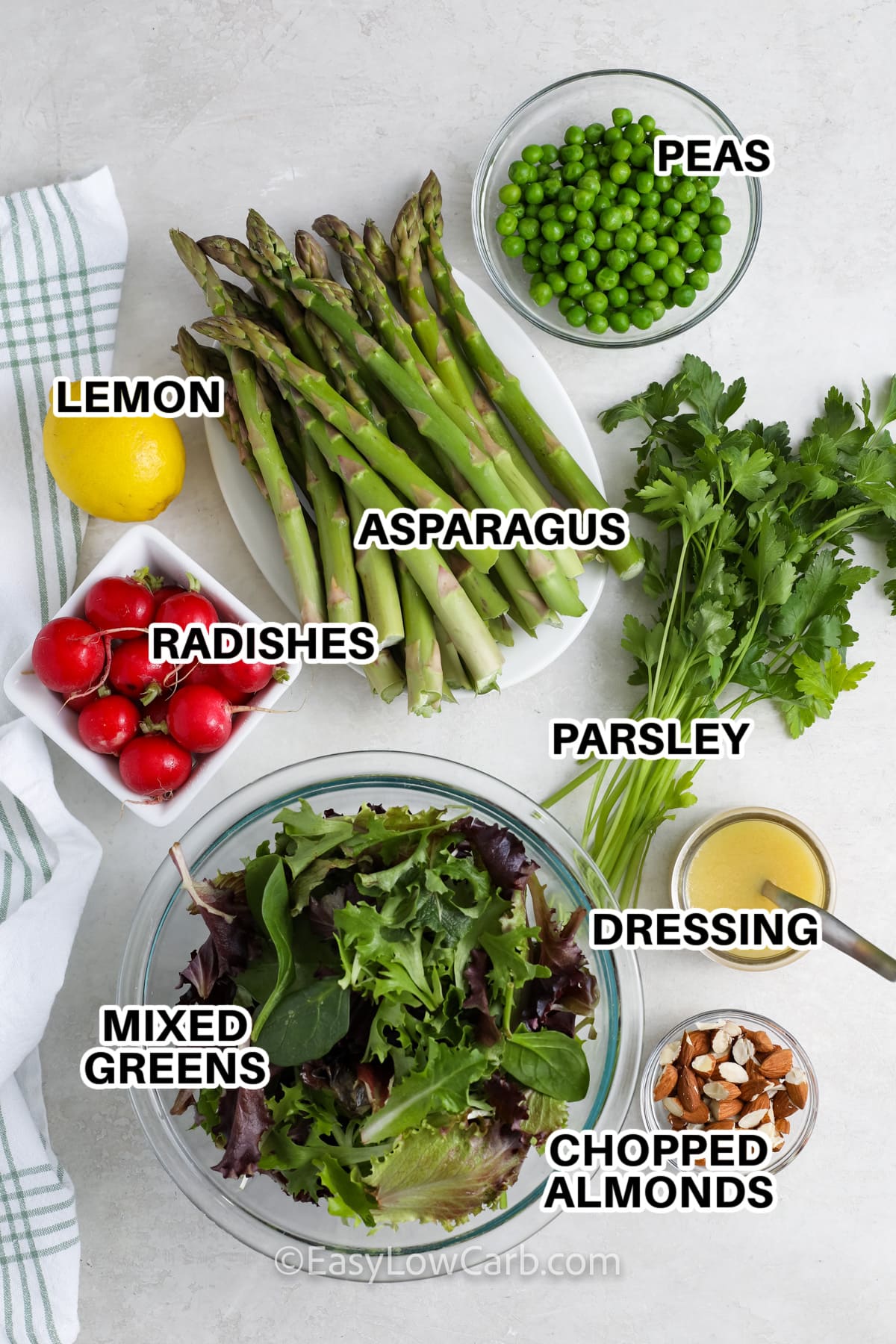 ingredients to make asparagus salad labeled: peas, lemon, asparagus, radishes, parsley