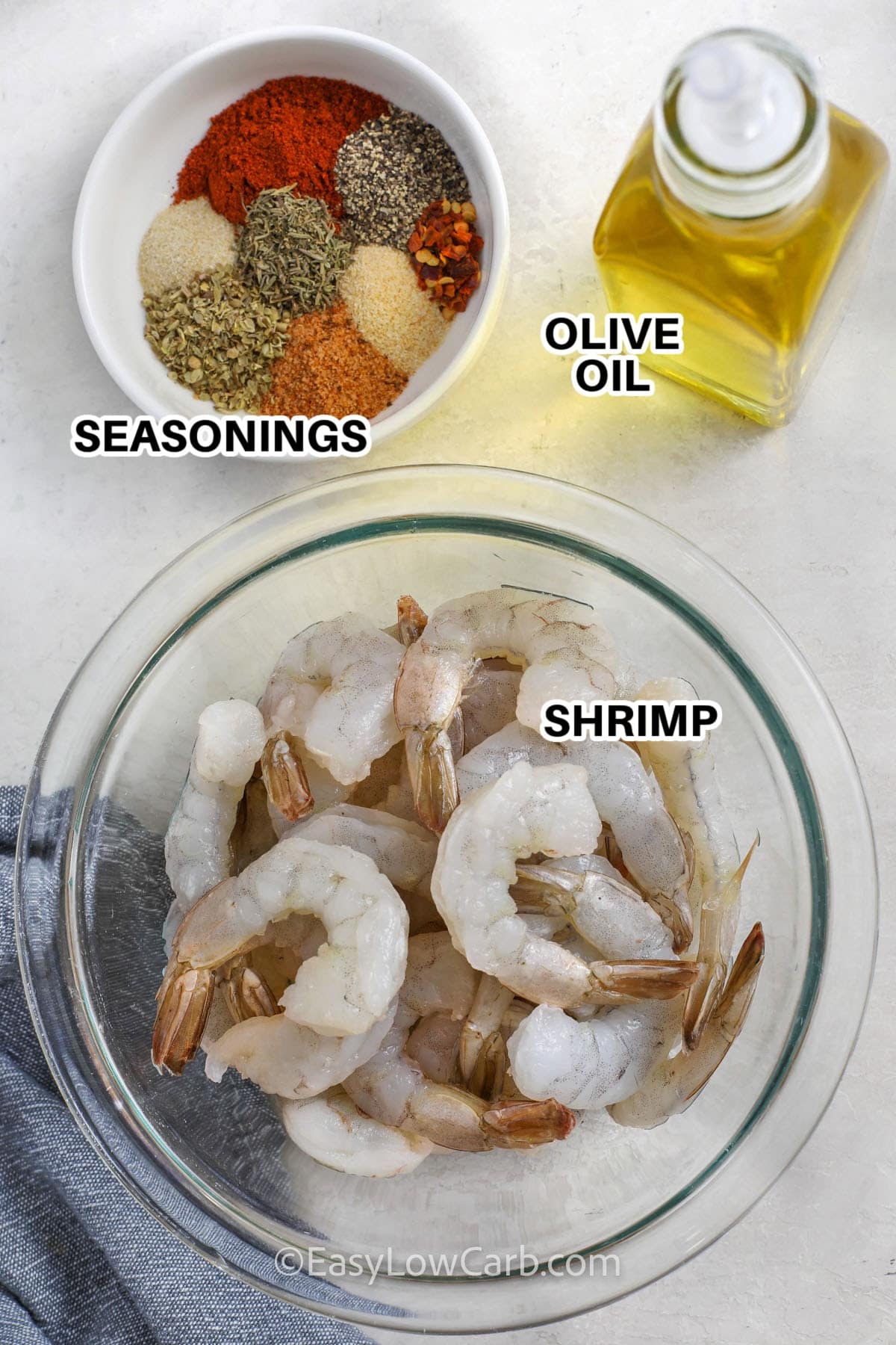 ingredients to make cajun shrimp labeled: seasonings, olive oil, and shrimp