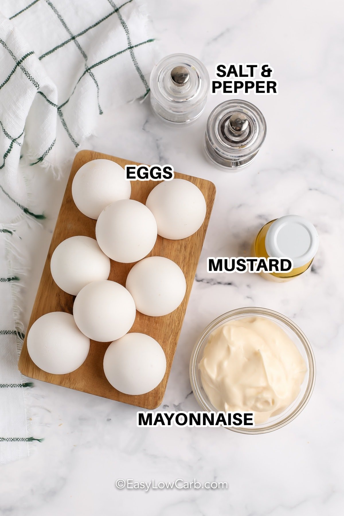 Ingredients to make Keto Egg Salad labeled: salt and pepper, mustard, eggs, and mayonnaise