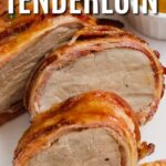 bacon wrapped pork tenderloin sliced on a plate with a title