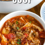 A bowl of cabbage roll soup with a title