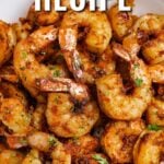 Cajun shrimp on a plate with a title
