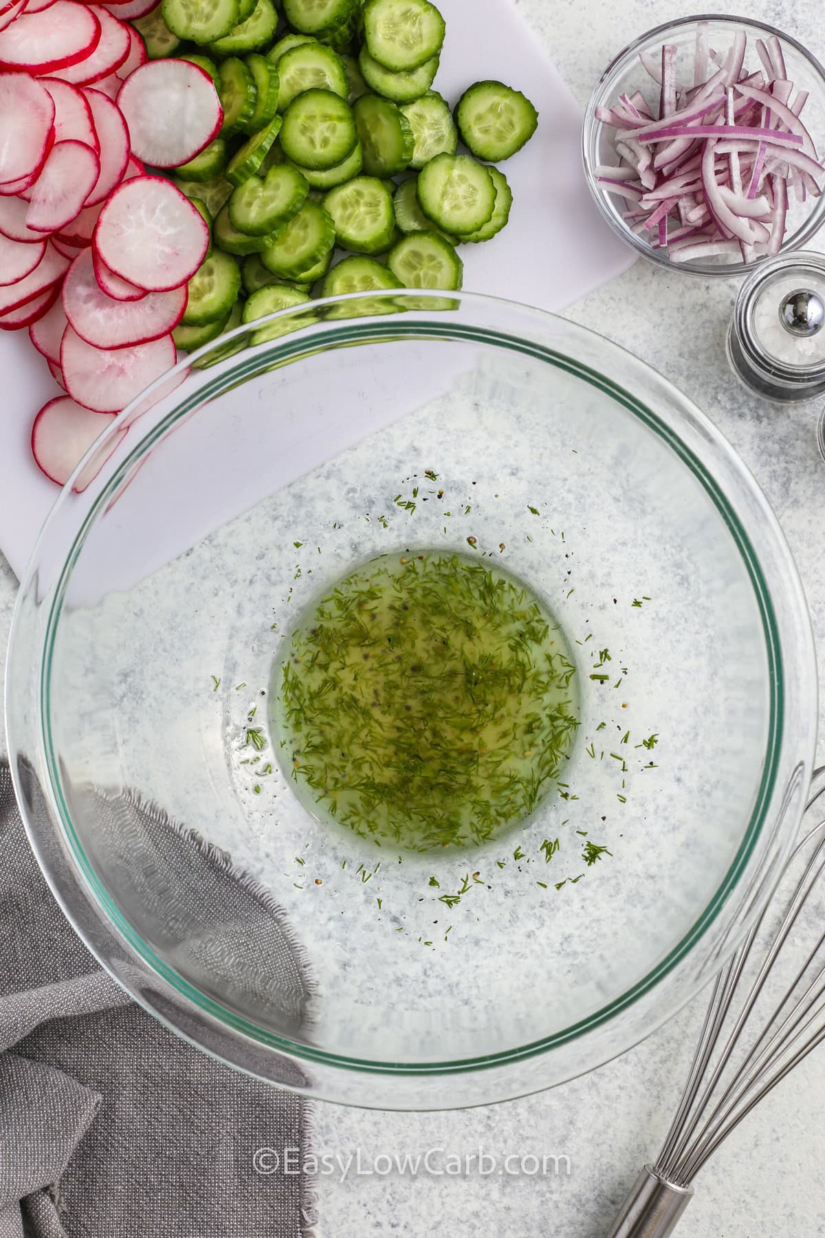 mixing ingredients for Cucumber Radish Salad dressing