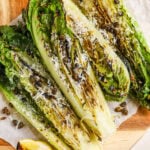 grilled romaine salad topped with parmesan cheese