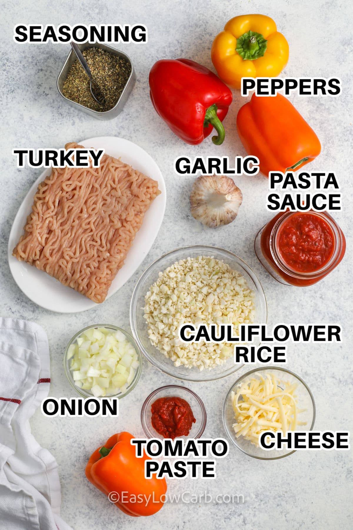 seasoning , turkey , garlic , peppers , pasta sauce , cauliflower rice , cheese , onion , tomato paste with labels to make Ground Turkey Stuffed Peppers