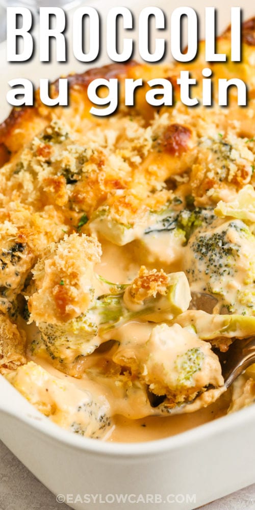 taking a spoonful of Broccoli au Gratin with writing
