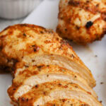 slices of cajun chicken with a title