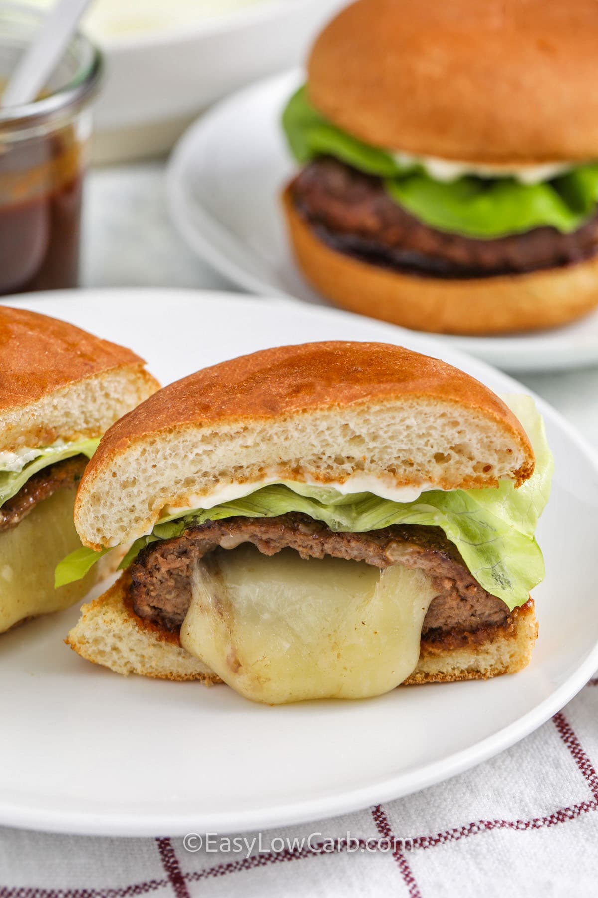 plated Stuffed Burgers with one cut in half