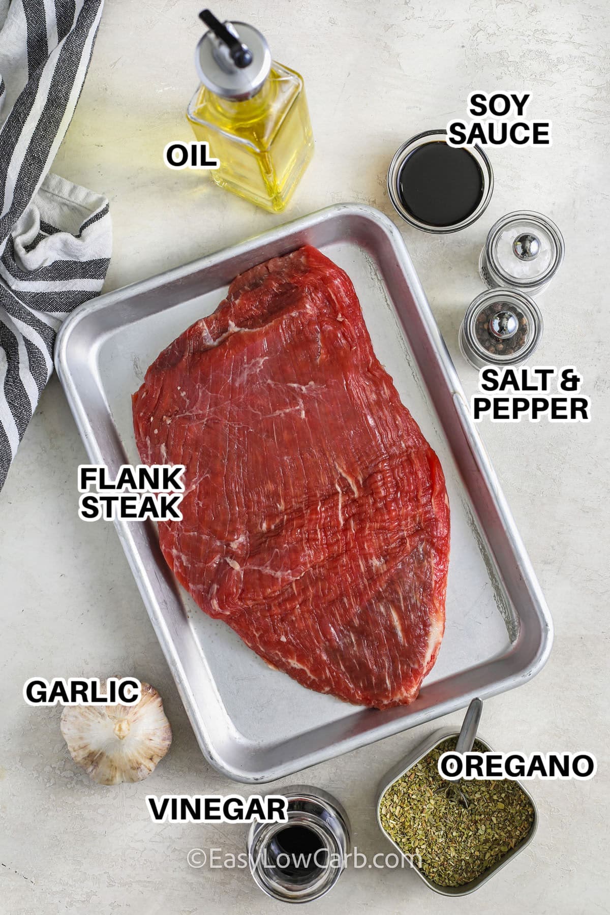 oil , soy sauce , flank steak , garlic , vinegar , oregano , salt and pepper with labels to make Grilled Flank Steak