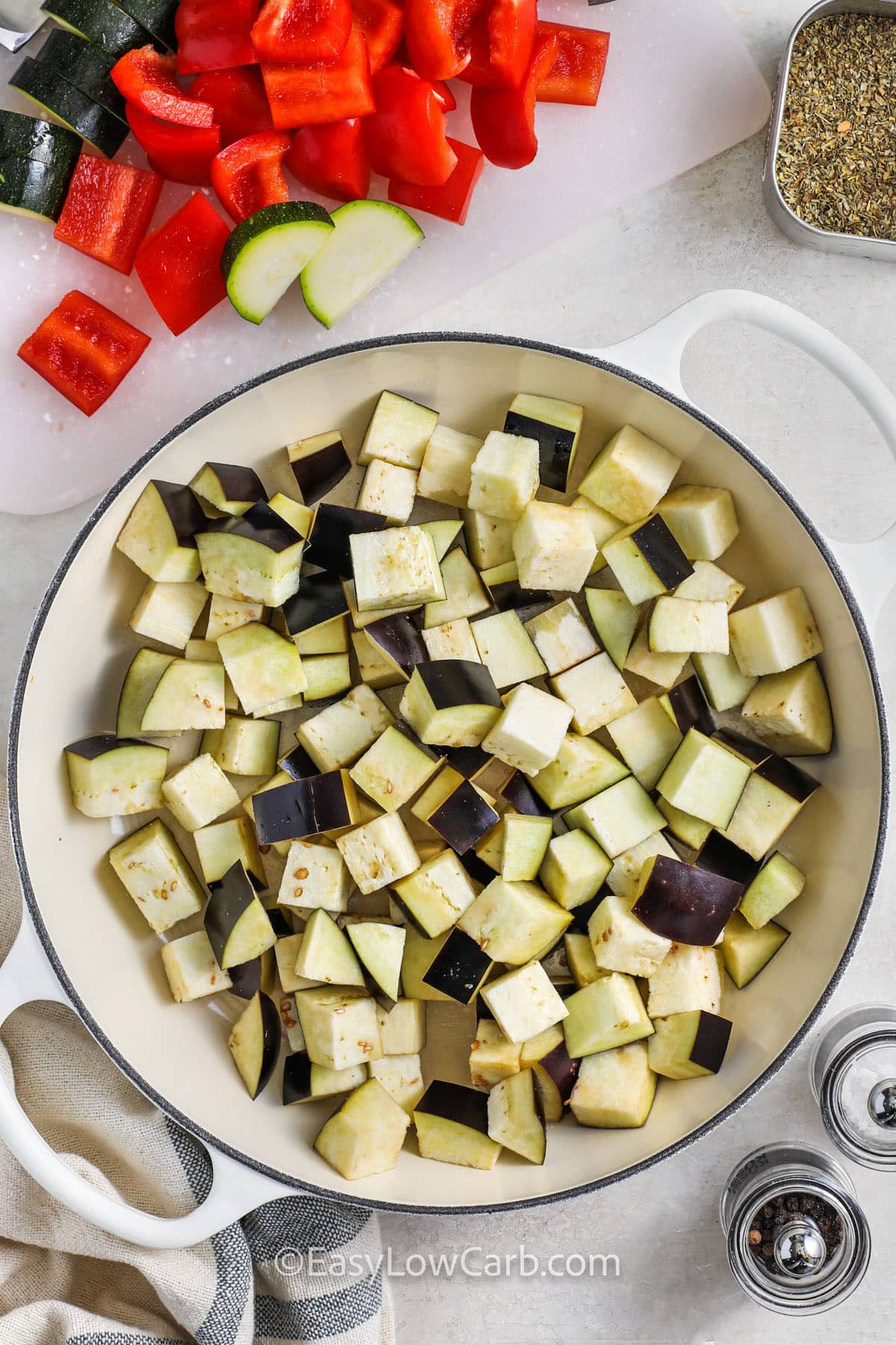 adding zucchini to pot to make Easy Ratatouille Recipe