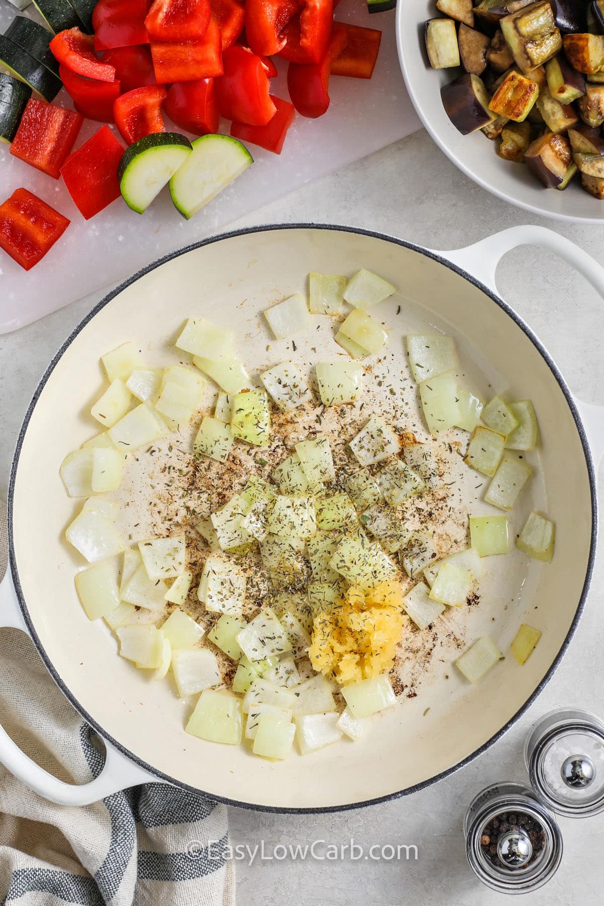 adding seasonings to onion to make Easy Ratatouille Recipe