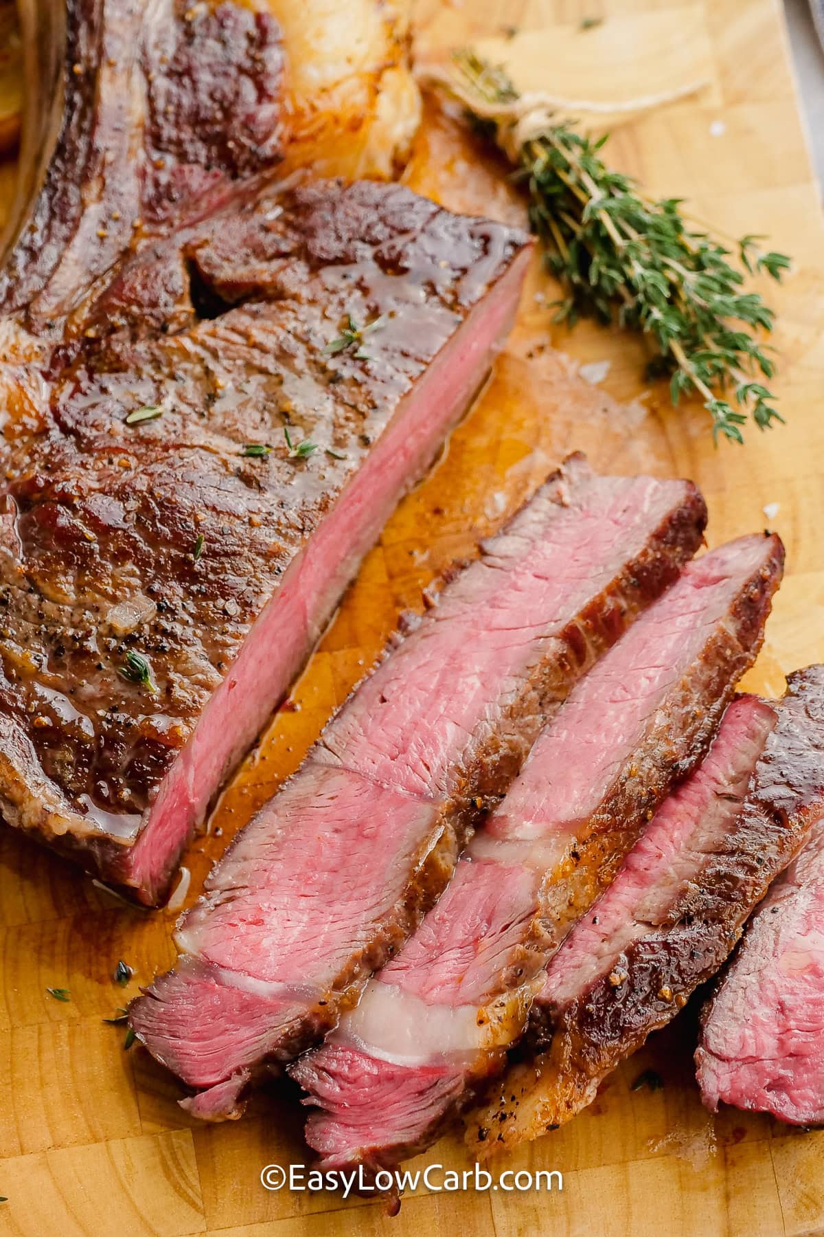 oven baked steak on a cutting board