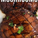 simple Grilled Portobello Mushrooms on a plate with writing