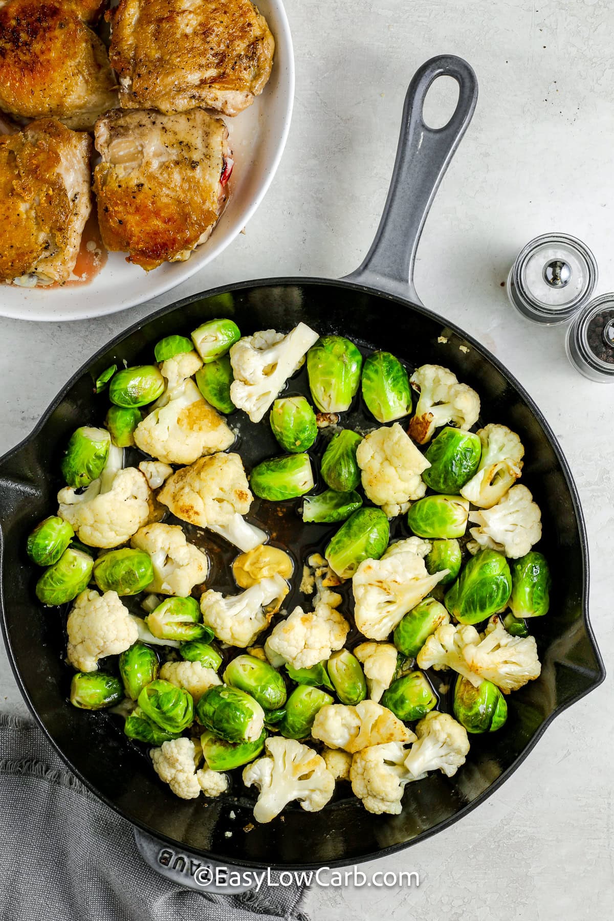 cauliflower and brussels sprouts in a pan