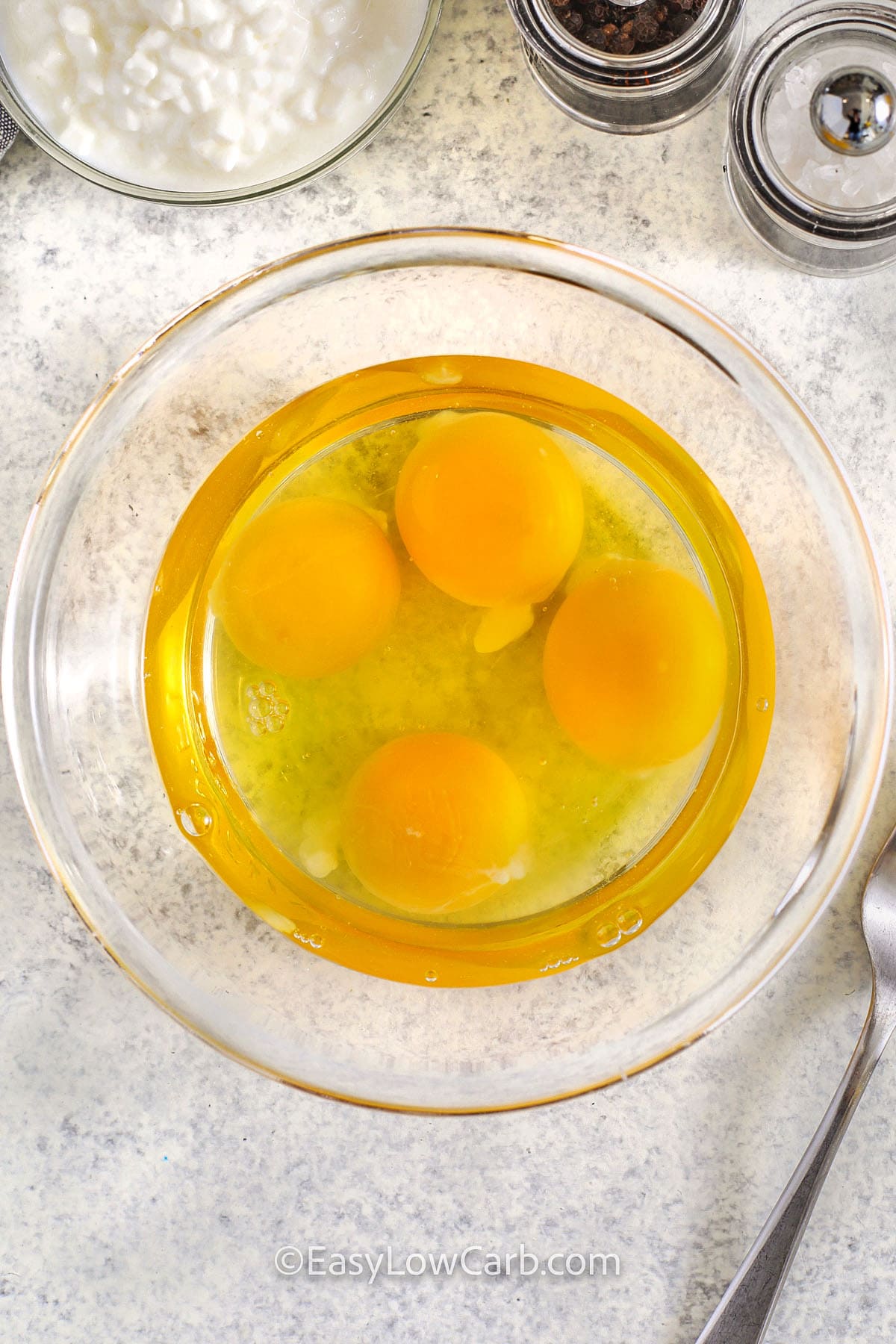 eggs in a bowl to make Cottage Cheese Scrambled Eggs