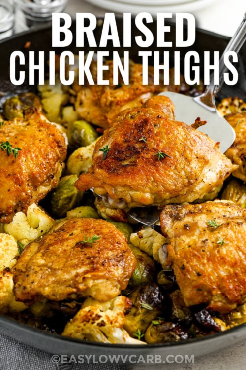 chicken thighs in a skillet with writing