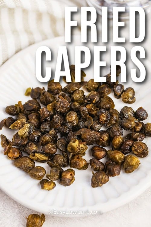 fried capers on a white plate with a title