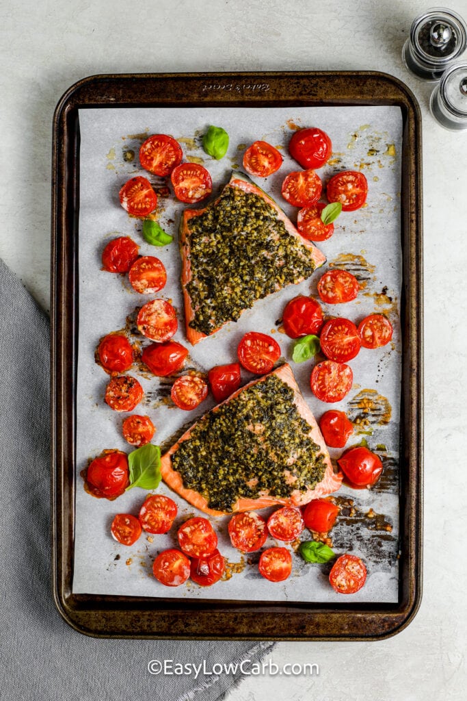 cooked pesto salmon on a pan