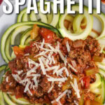 plated Zucchini Spaghetti with a fork and writing