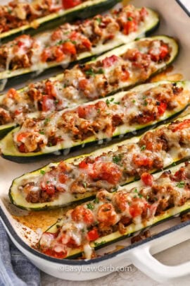 stuffed zucchini boats baked in a casserole dish