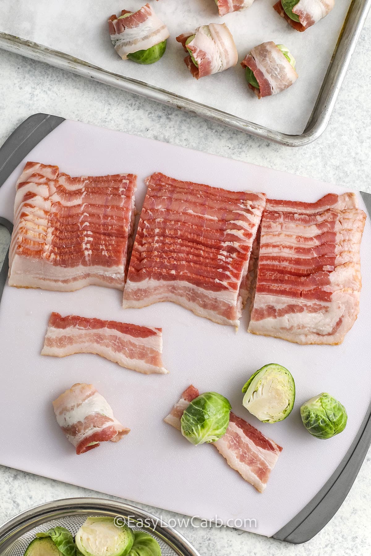 bacon and brussel sprouts being prepared on a tray