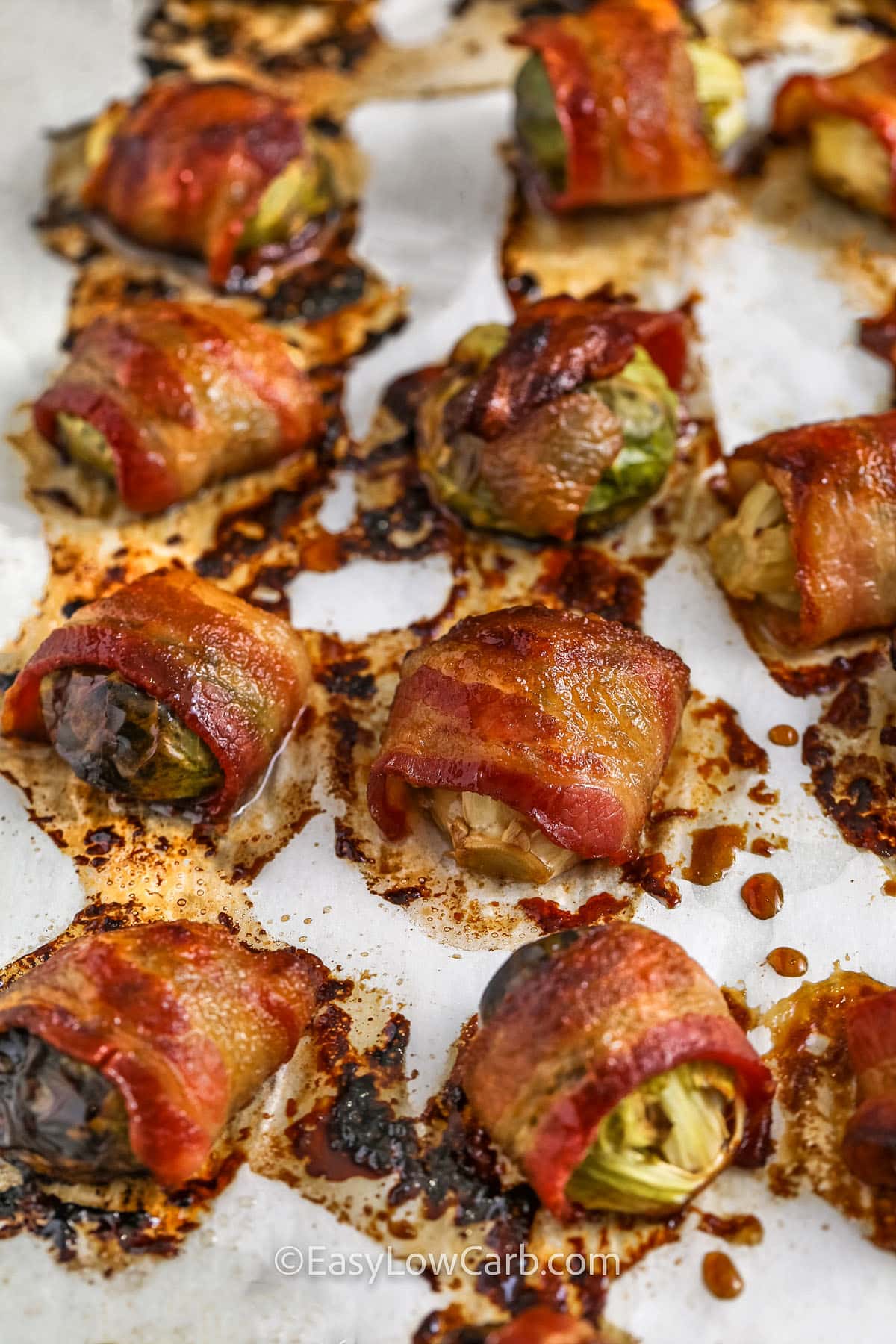 bacon wrapped brussel sprouts on parchment