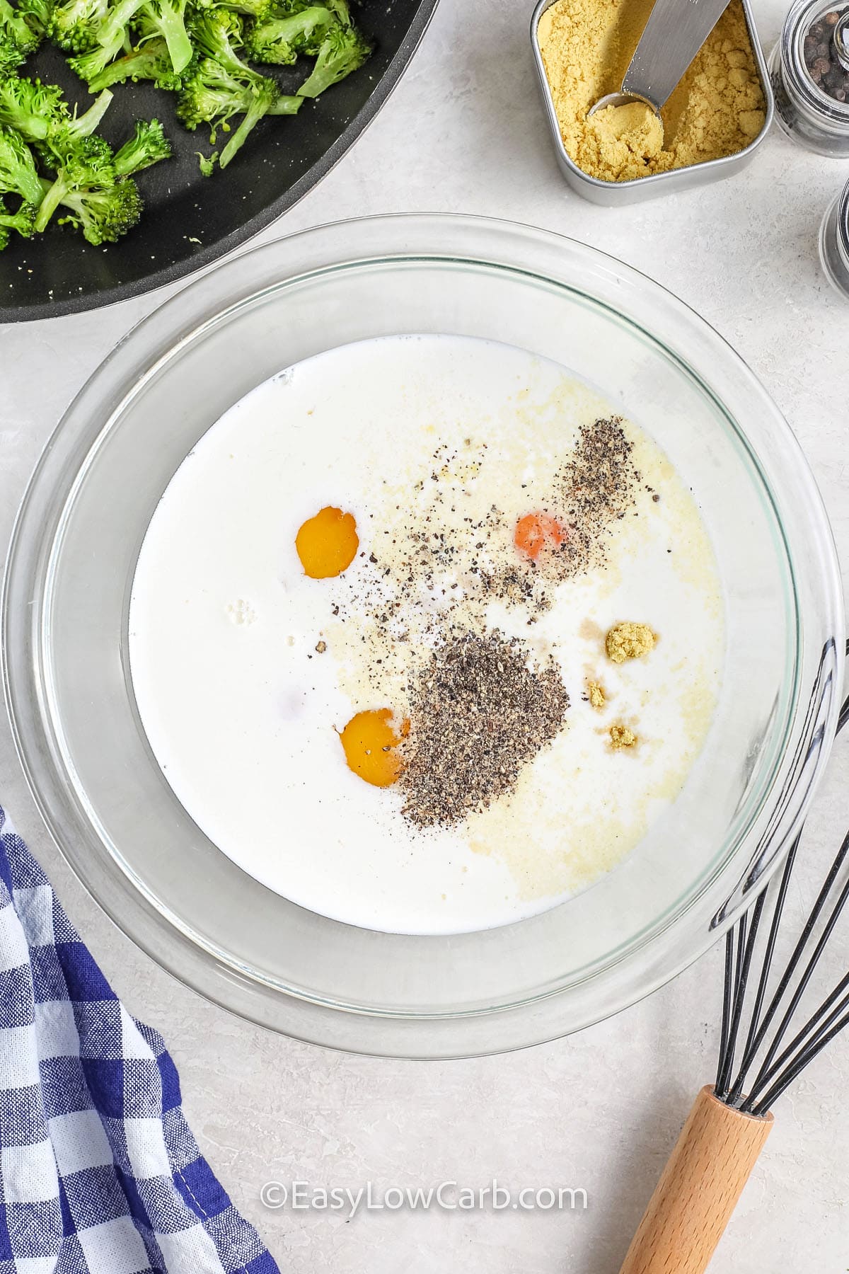 Ingredients to make a Broccoli Cheese Quiche being combined in a bowl