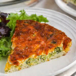 a serving of broccoli cheese quiche on a plate